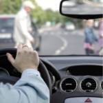 The driver and a pedestrian at a crosswalk